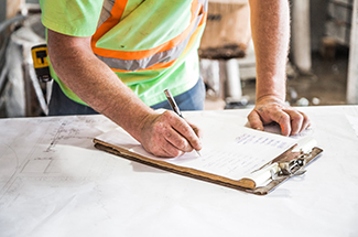 construction worker writing